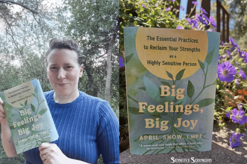 Author holding book and book set near purple flowers