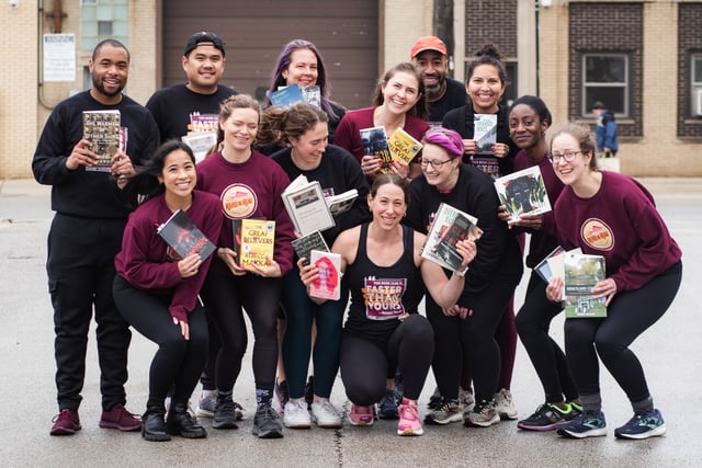 read and run group posing with books