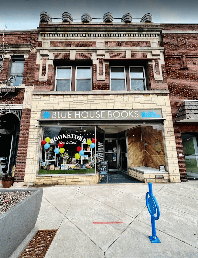 Exterior image of Blue House Books, brick building with large windows