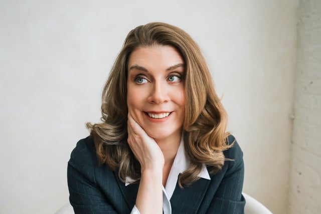 Joanna Shupe sitting in a chair